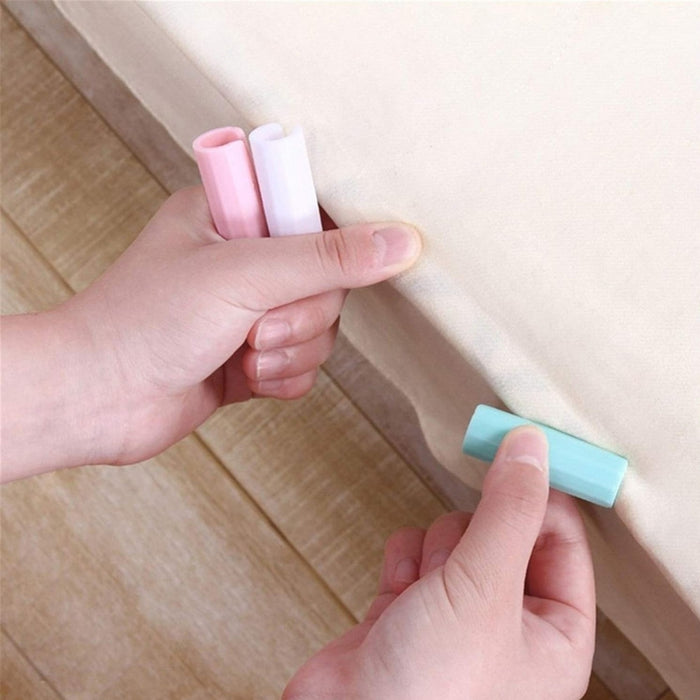 Digital Shoppy Sheet Fixing Clip, hands using pastel clips to secure sheet on mattress – 12 pack