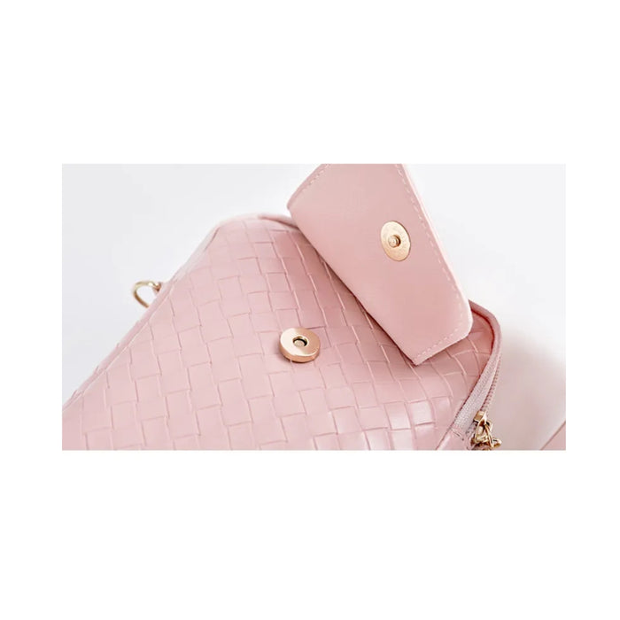 Pink textured handbag with gold buttons on a white background