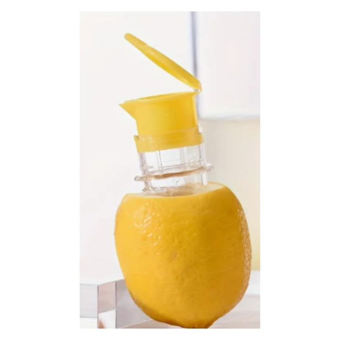 A yellow citrus juicer attachment with a hinged yellow lid and clear plastic body, mounted on a whole lemon.