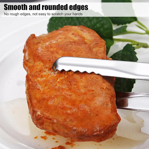 Metal tongs with smooth rounded edges holding grilled chicken breast – safe design prevents hand scratches during food handling