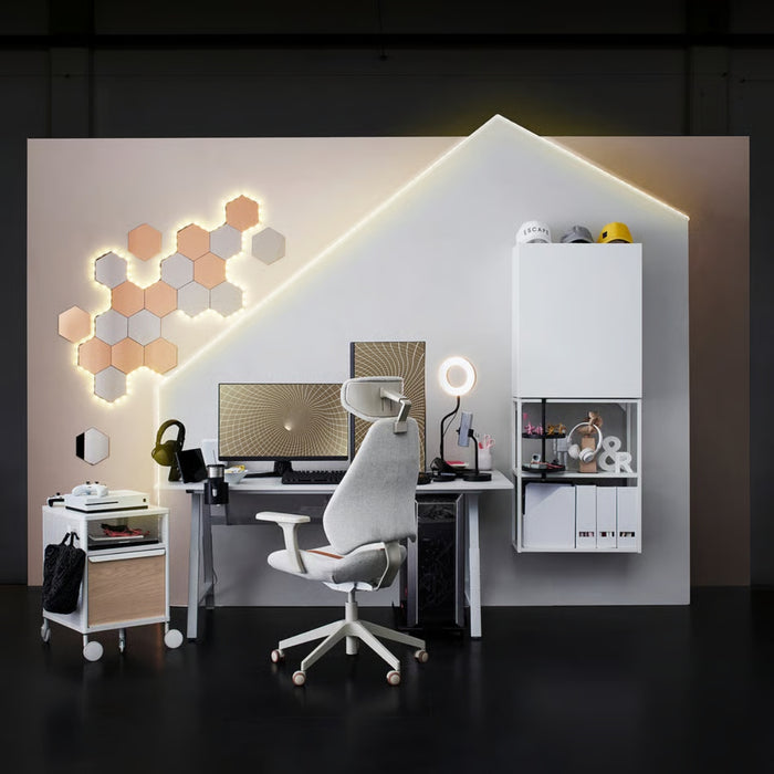 Modern office setup with hexagonal light panels on the wall