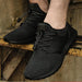 Digital Shoppy Black athletic shoes worn with elastic laces and toggle lock on rusted metal surface