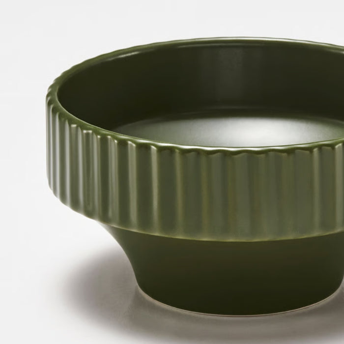 Dark green SPJUTLILJA bowl with vertically ribbed texture and glossy finish, tapering into smooth narrow base
