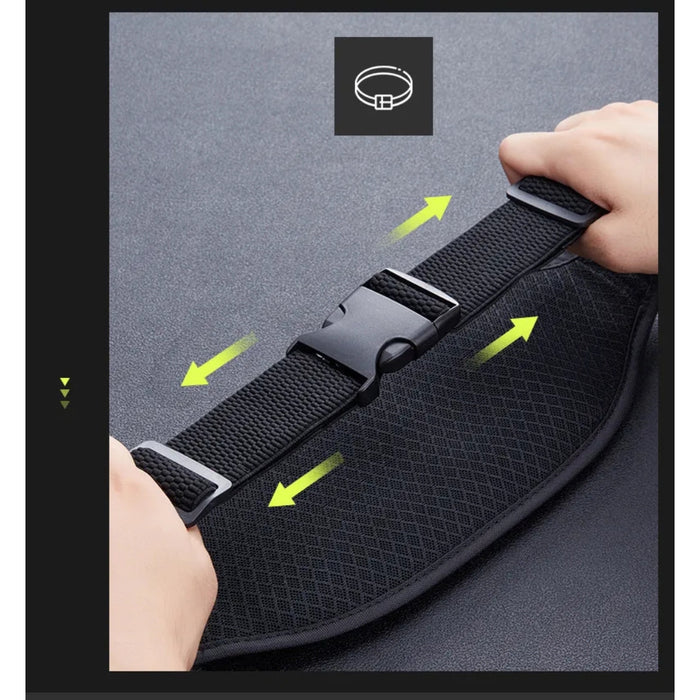 Black mesh belt with a metal buckle held by hands on a gray background