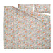 Floral patterned bed sheet set on a white background