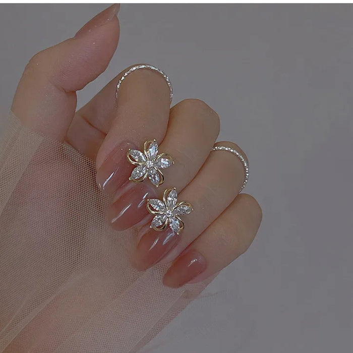 Digital Shoppy High-grade Ear Studs, floral zircon rings on mauve-painted nails with sheer fabric overlay