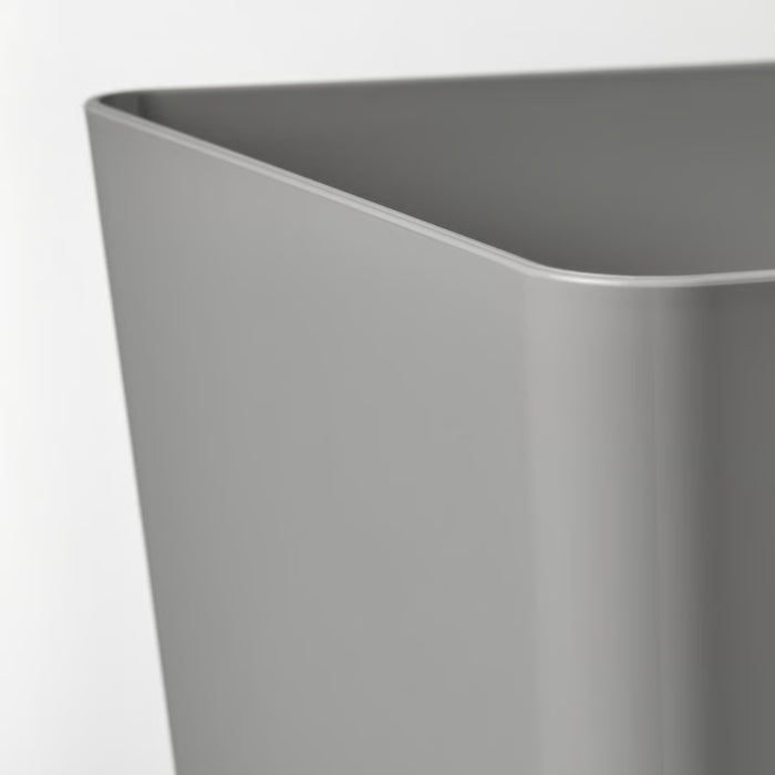 Close-up of a gray rectangular storage container with smooth, rounded edges, set against a plain white background—minimalist design ideal for organizing household items.-20599149