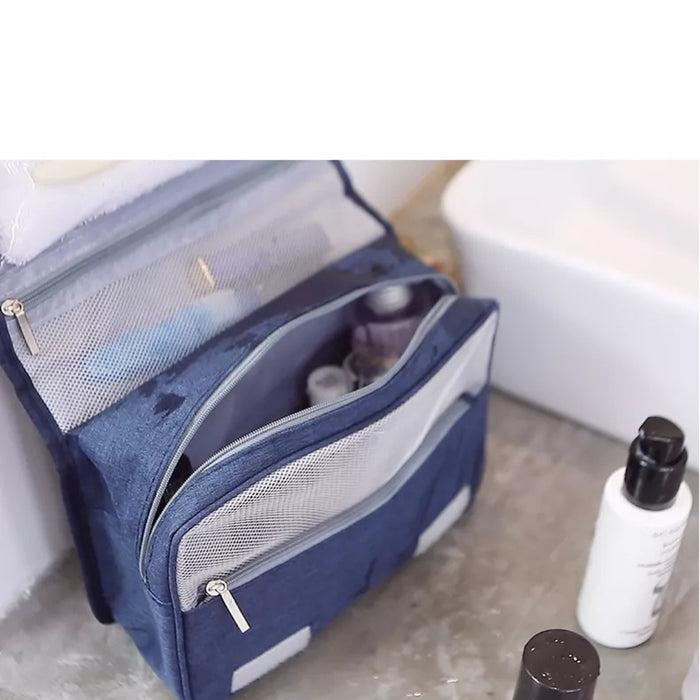 Travel storage waterproof bag, blue. Shown open on bathroom counter with mesh zip pockets and bottles – compact case keeps essentials organized near sink – 13403615.