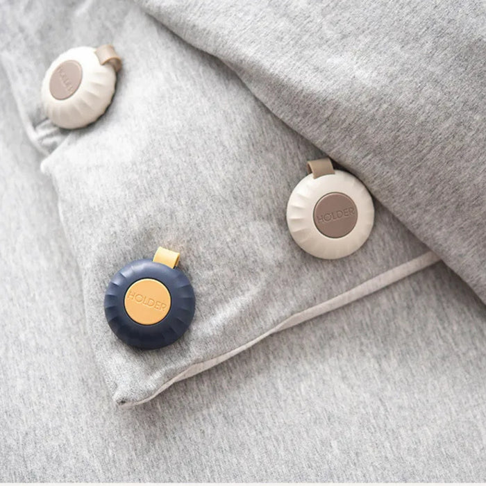 Three round heating pads on a gray textured surface