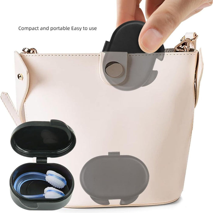 Compact storage case with blue and white earplugs held above handbag - 