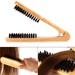 Wooden hairbrush with black bristles on a white background, shown in different angles.