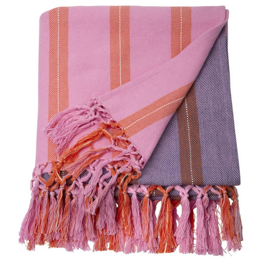 IKEA MÄVINN throw folded neatly, showing pink and orange striped woven fabric with decorative fringe tassels