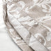 Close-up of beige and white floral patterned fabric with button closure. Highlighting the IKEA VÅRBRÄCKA Duvet Cover and Pillowcase, elegant and stylish bedding-00412614, 10424225 