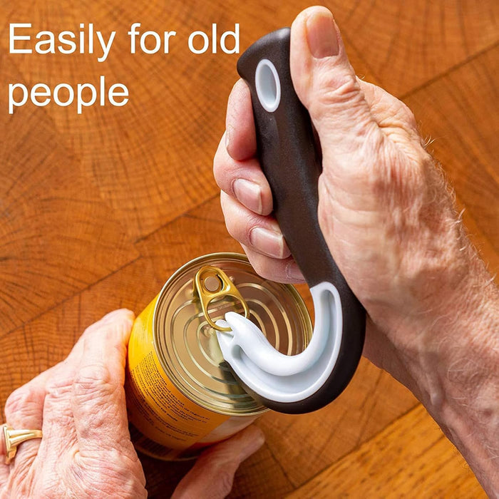 Person using a can opener on a can with text 'Easily for old people' on a wooden surface.