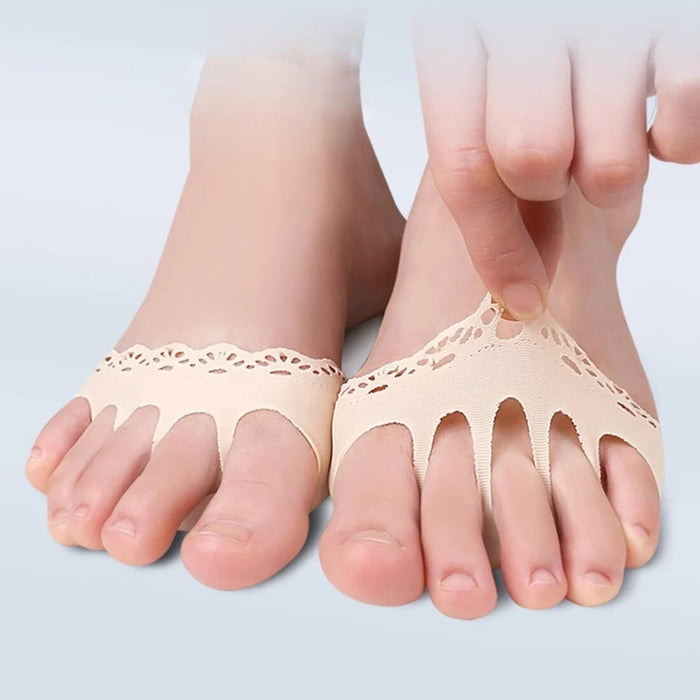 Beige split-toe foot pads with a lace-like trim, designed for toe separation and comfort. Helps alleviate pressure and enhance stability, ideal for foot care and daily wear. Image shows application on both feet with hand adjustment-1598449642767
