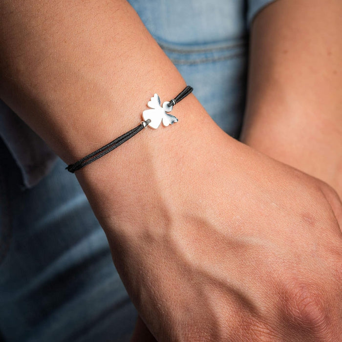 Couple Angel Bracelet – Adjustable Wax Cord, Stainless Steel Charm, worn with denim outfit, featuring angel charm