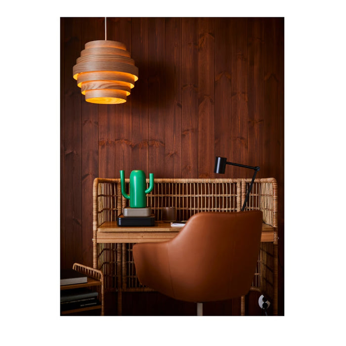 Modern office setup with wooden desk, chair, and pendant light against a wooden wall.