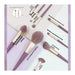 Set of makeup brushes with labels on a white background