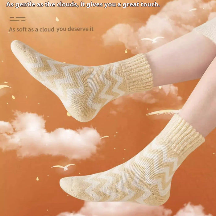 Mango yellow zigzag socks floating in dreamy cloud background with comfort-themed text