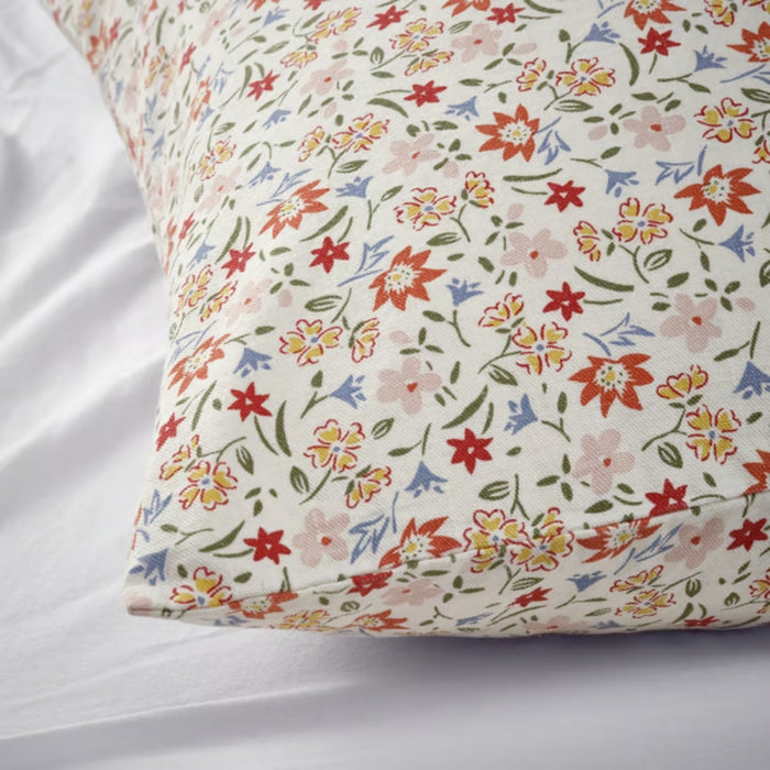 ULLNATTLJUS cushion cover, white/floral, 50x50 cm. Features multicolour flowers on white cotton – adds soft, botanical charm to bedding setup – 90598702.