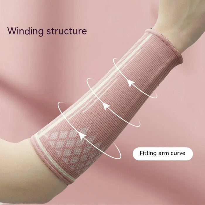 Pink volleyball arm guard with ribbed texture and spiral arrows – winding structure conforms to forearm curve for compression support – 1600002527315