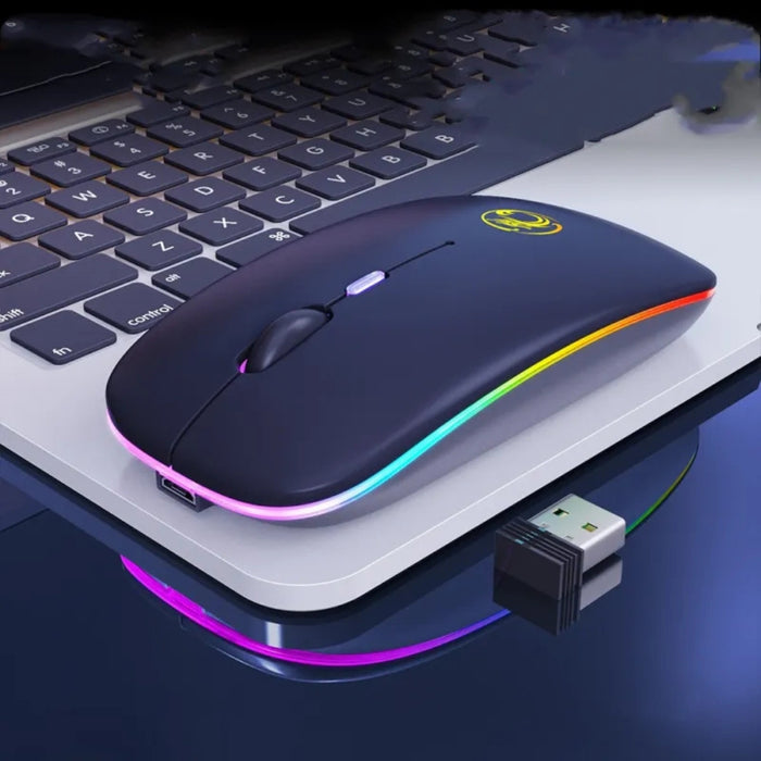 Blue wireless mouse with rainbow accents on a laptop