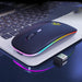 Blue wireless mouse with rainbow accents on a laptop