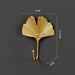 Gold ginkgo leaf hook – labeled dimensions: 9×11.5×3 cm for home organization