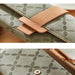 Green women’s wallet – close-up of textured floral pattern and matte tan strap with metallic snap