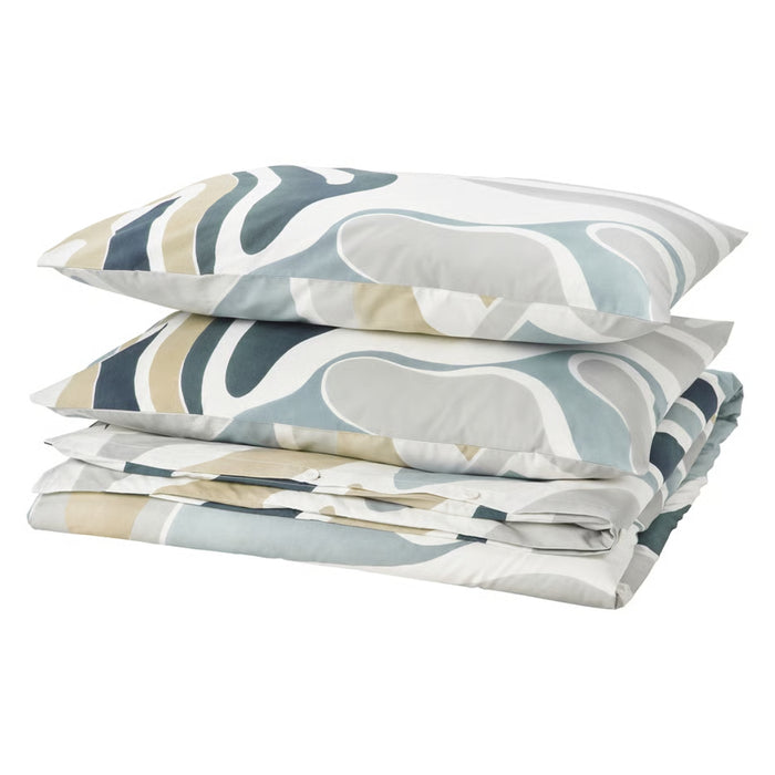 Patterned bed sheets and pillows on a white background