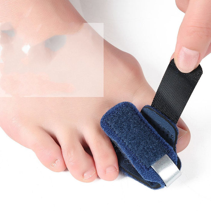 A beige or black elastic finger brace with a soft padded strap, wrapping around the finger joint to provide compression and support for arthritis, sprains, or injuries