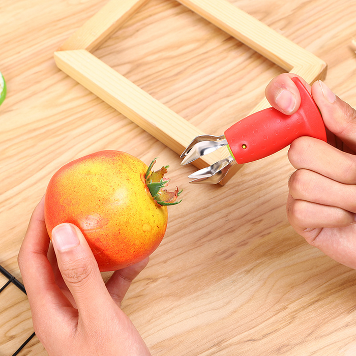 Dual-function kitchen gadget removing both strawberry stems and tomato stalks"