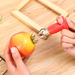 Dual-function kitchen gadget removing both strawberry stems and tomato stalks"