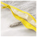 Close-up of a yellow zipper on a gray fabric background