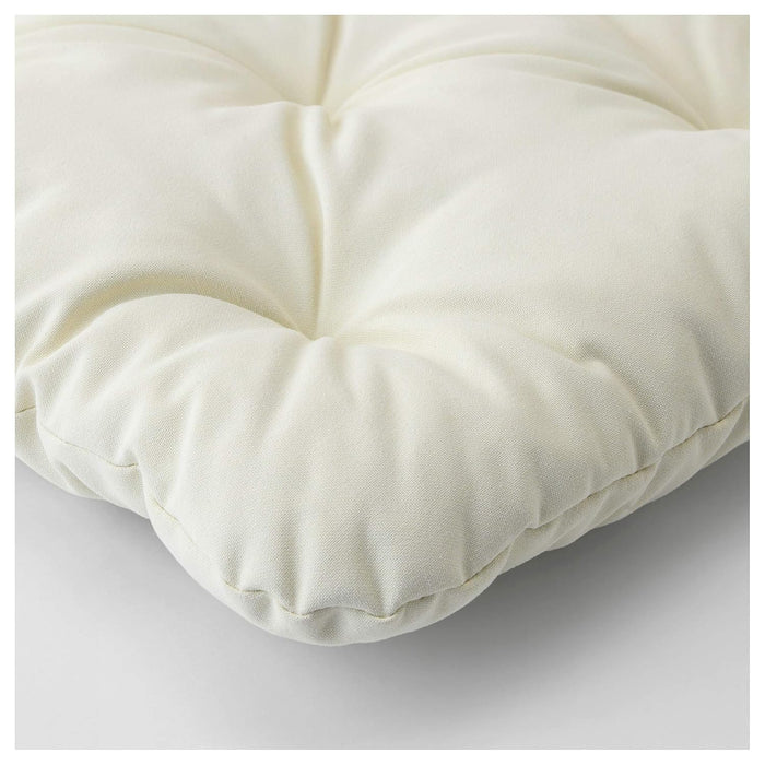White cushion on a light gray background