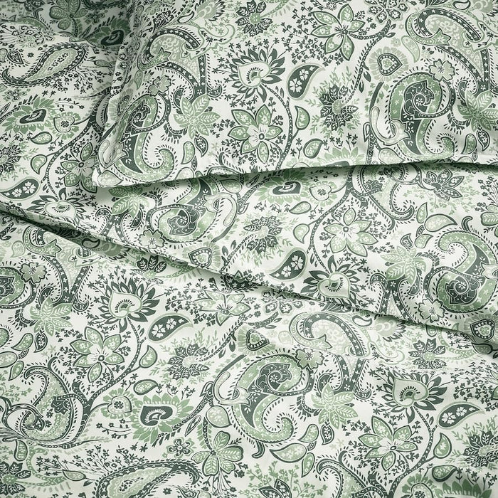 Close-up of IKEA RODGERSIA bedding showing floral green and white pattern
