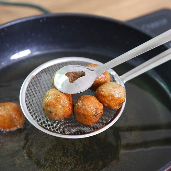 Fried food items being scooped with a strainer over a frying pan.