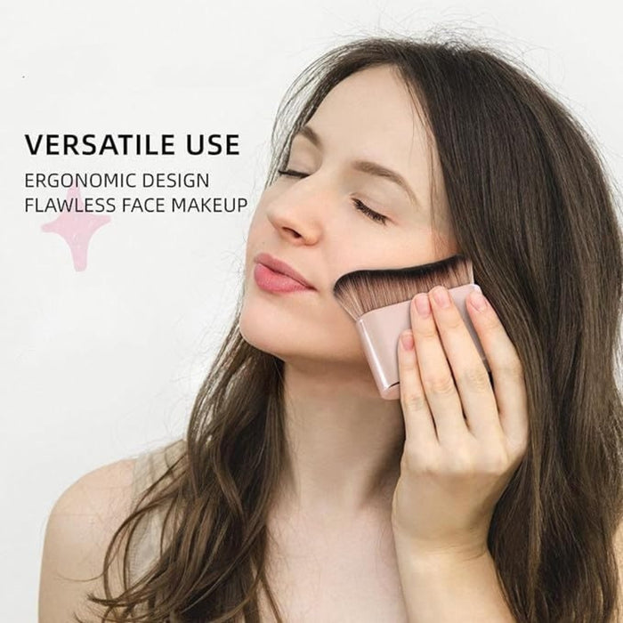 Large flat rose gold makeup brush applied to cheek for flawless face makeup demonstration