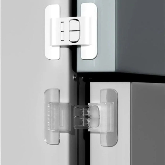 Close-up of a glass shower enclosure with clear silicone seals and white corner brackets.