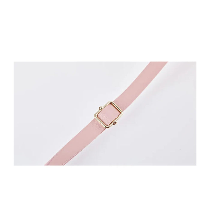 Pink belt with a gold buckle on a white background