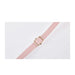 Pink belt with a gold buckle on a white background