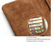 Brown suede wallet with five horizontal card slots – magnified inset shows credit and business cards in textured stitched compartments – 411355 13972034
