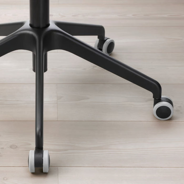 Black office chair base with wheels on a light wooden floor