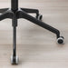 Black office chair base with wheels on a light wooden floor