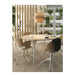 Round wooden table with chairs in a modern office setting