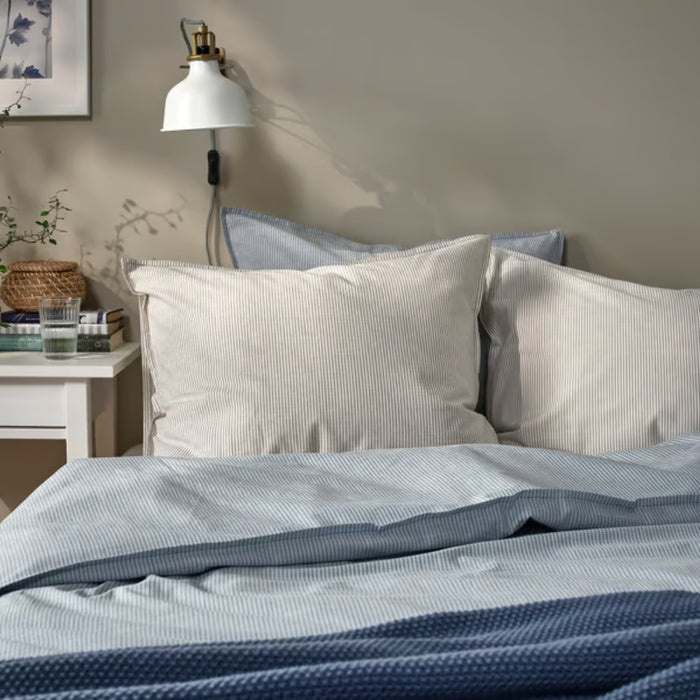 BERGPALM pillowcase, grey/striped, 50x80 cm. Shown on bed with matching striped bedding, white nightstand, books, and wall lamp – adds calm, lived-in charm to bedroom – 80577149.