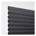 Black pleated blind on a white background