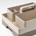 Beige and gray storage tray with compartments and a handle on a light gray background