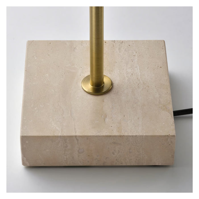 Beige stone base with gold metal stand on a white background