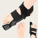 lose-up of right foot in black bunion corrector brace showing padded straps and hinge mechanism